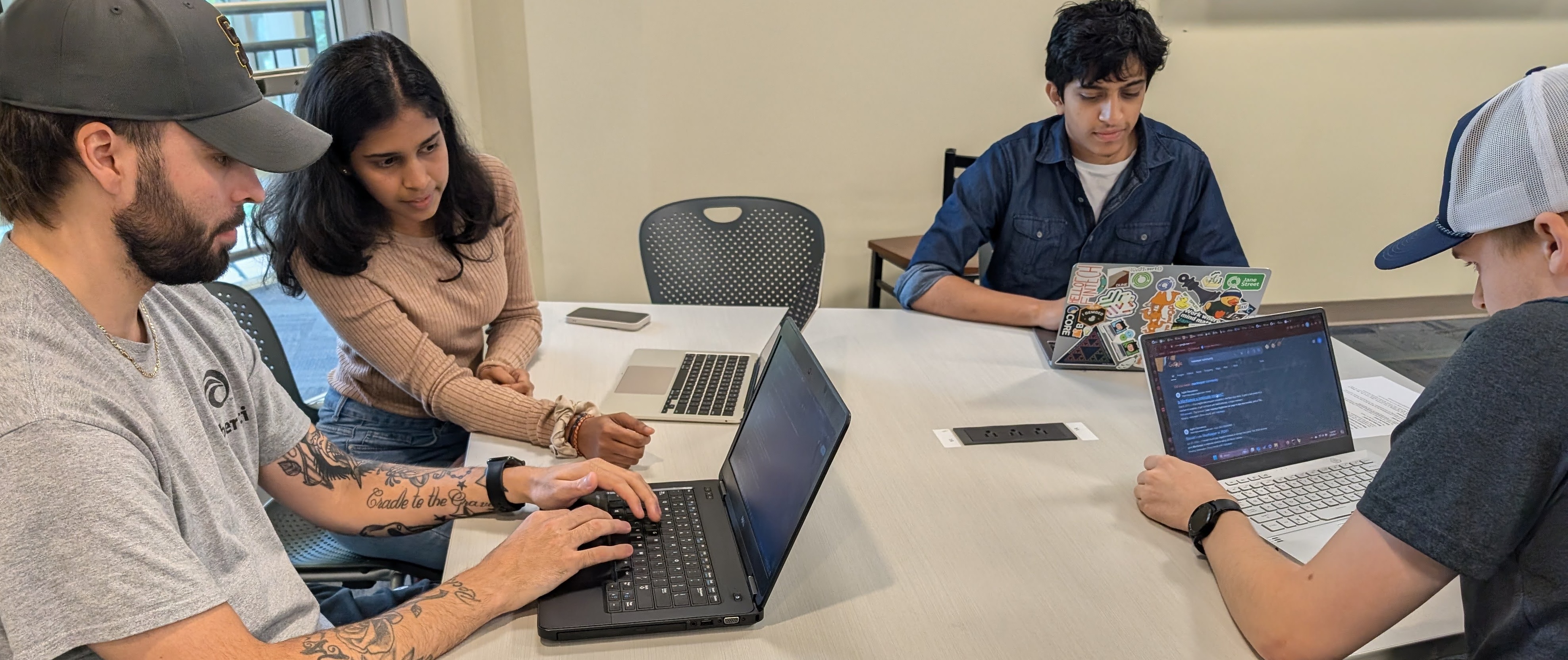undergraduate developers and graduate student leaders collaborating